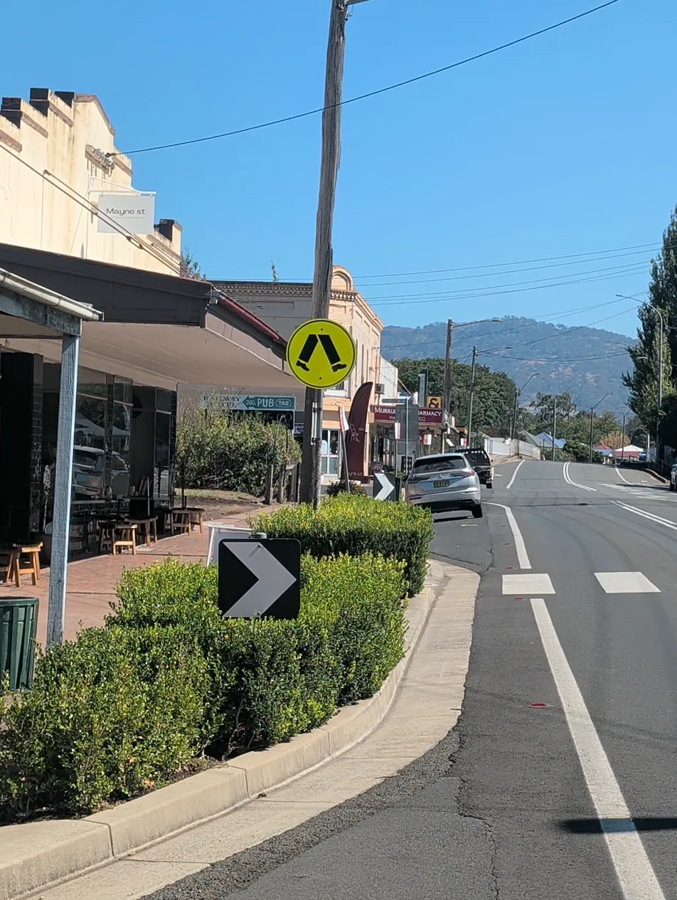 Crossing hard to see among buildings and street furniture